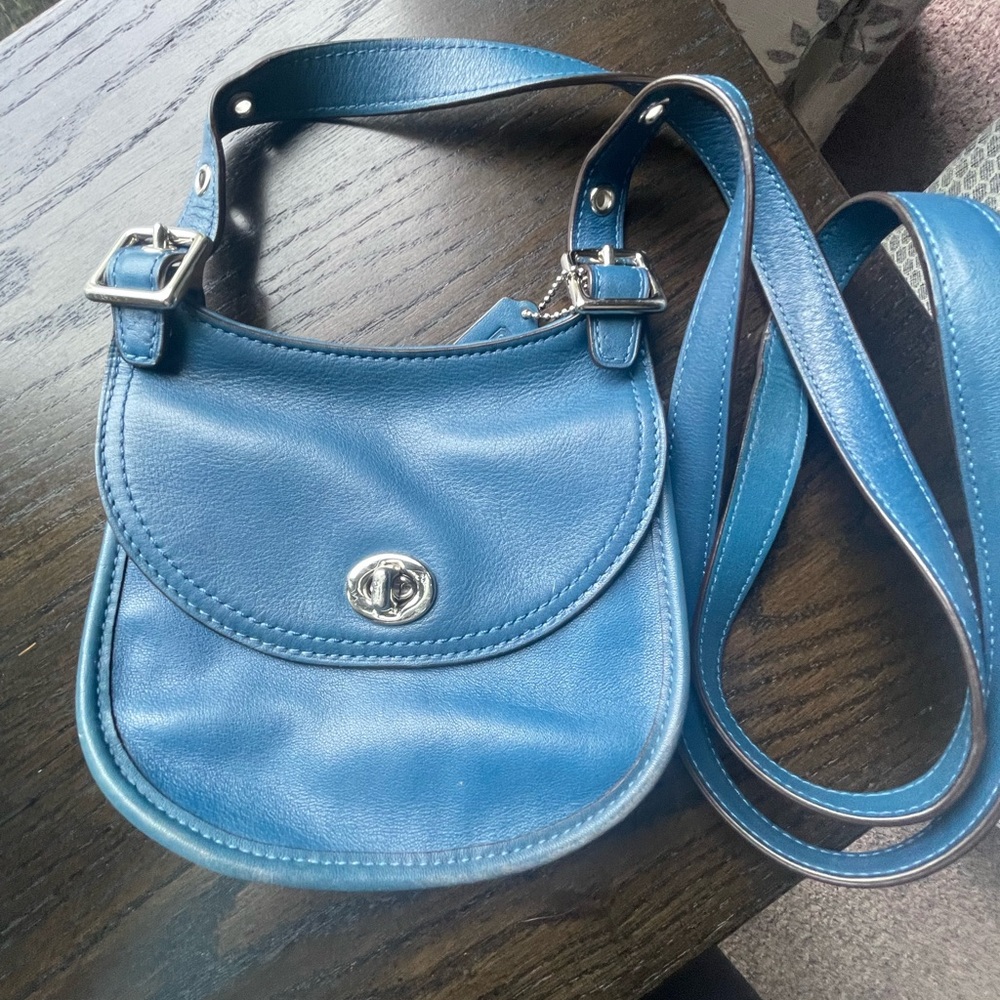 Coach Mini Saddle Blue Crossbody Bag with Adjustable Strap and Turn-Lock Closure